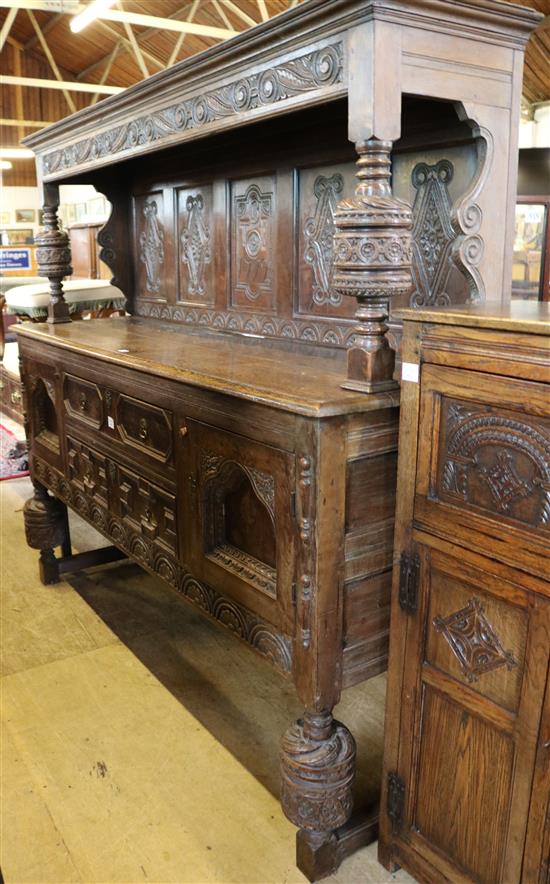Large 17th century style oak court cupboard, bearing date 1712, 7ft 8in.